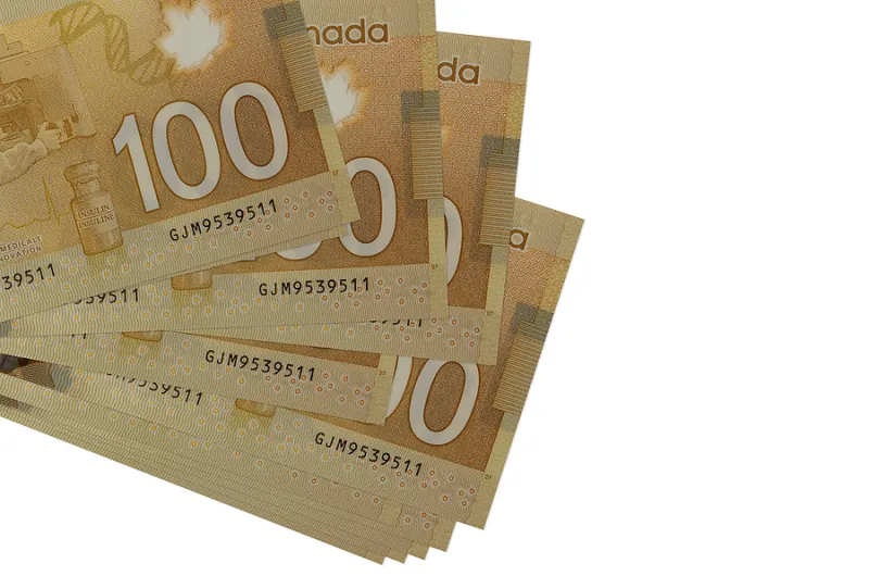 100 Canadian Dollars Bills Lies In Small Bunch Or Pack Isolated