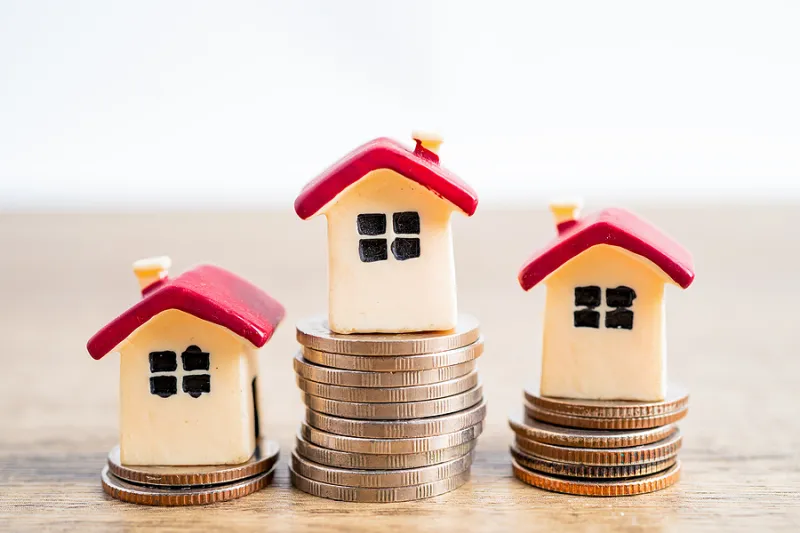 House On Stack Coins, Mortgage Home Loan Finance Concept.